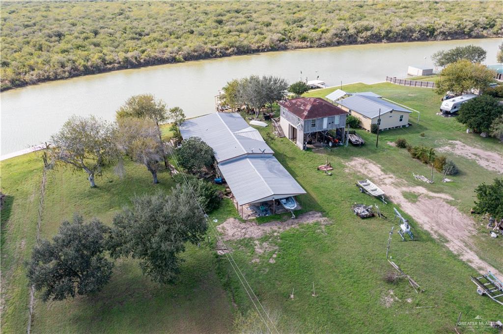 32487 Farm To Market Road 2925 Rio Hondo, TX 78583 - Photo 4 of 7 an aerial view of residential houses with outdoor space and lake view