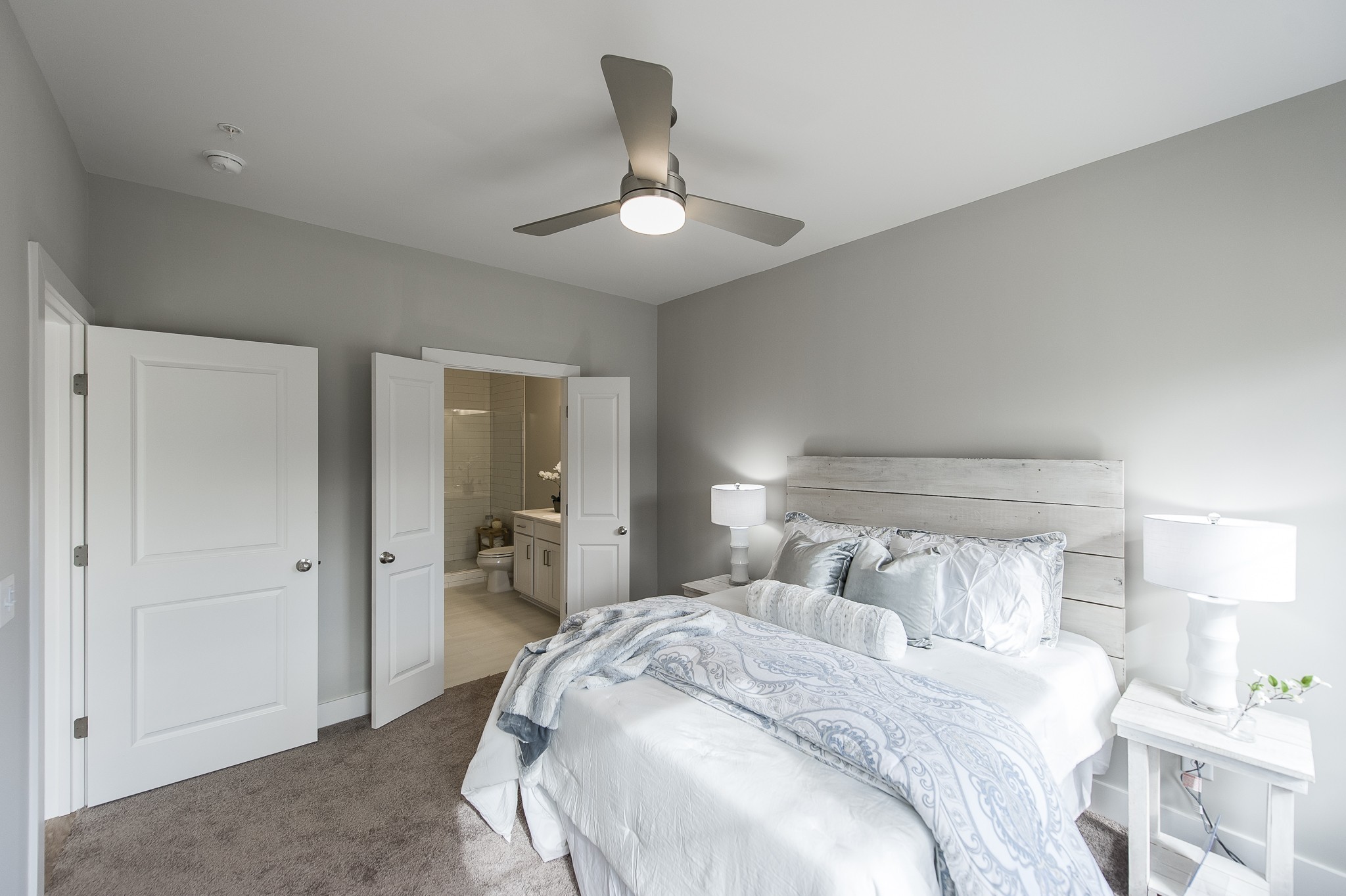 1144 Lock 4 Road, Unit B2 Gallatin, TN 37066 - Photo 10 of 17 a bedroom with a bed and a large mirror