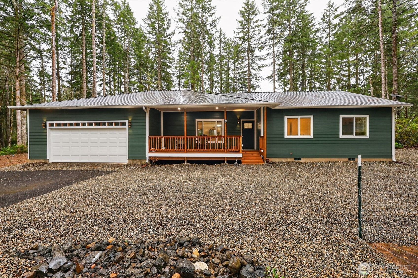 a view of a house with a yard and garage