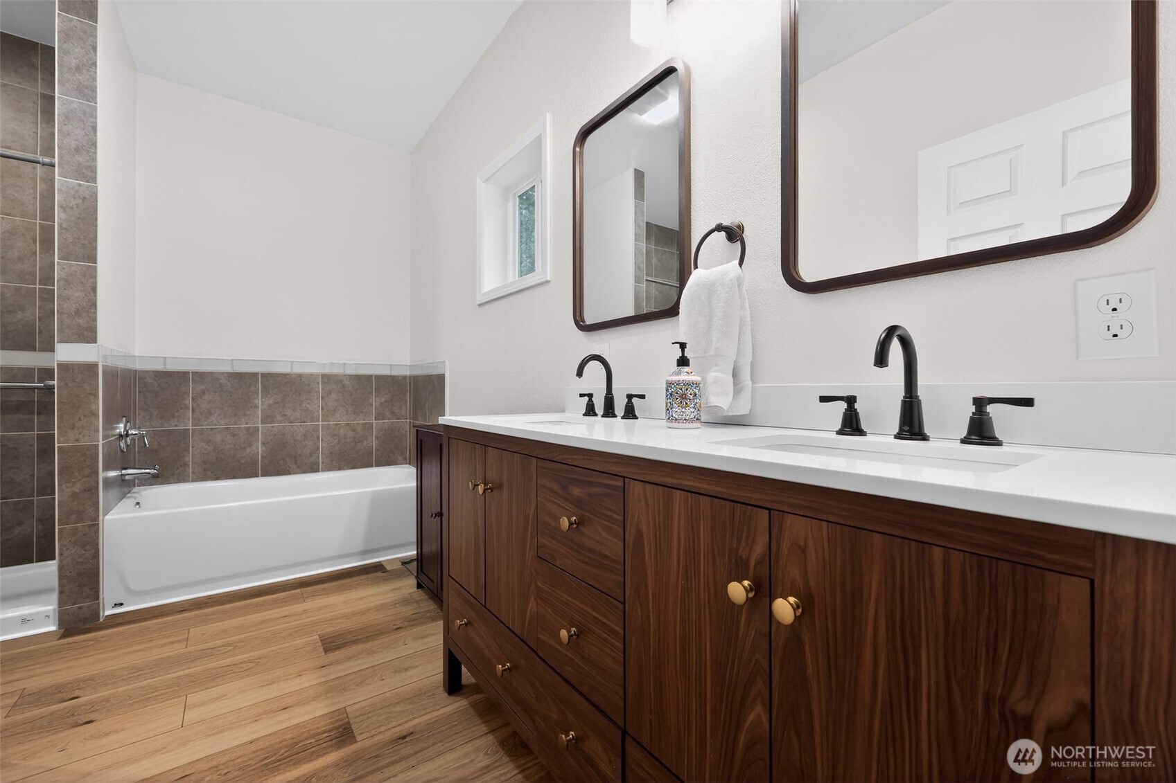 148 East Fox Run Lane Grapeview, WA 98546 - Photo 17 of 32 a bathroom with a double vanity sink a mirror and bathtub