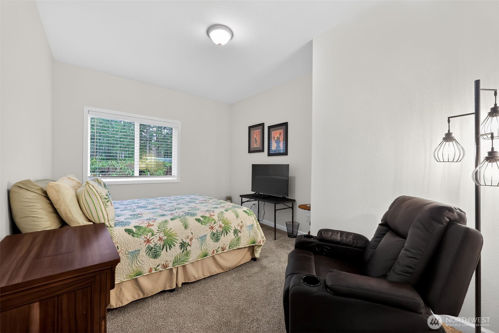 148 East Fox Run Lane Grapeview, WA 98546 - Photo 24 of 32 a bedroom with bed couch and window