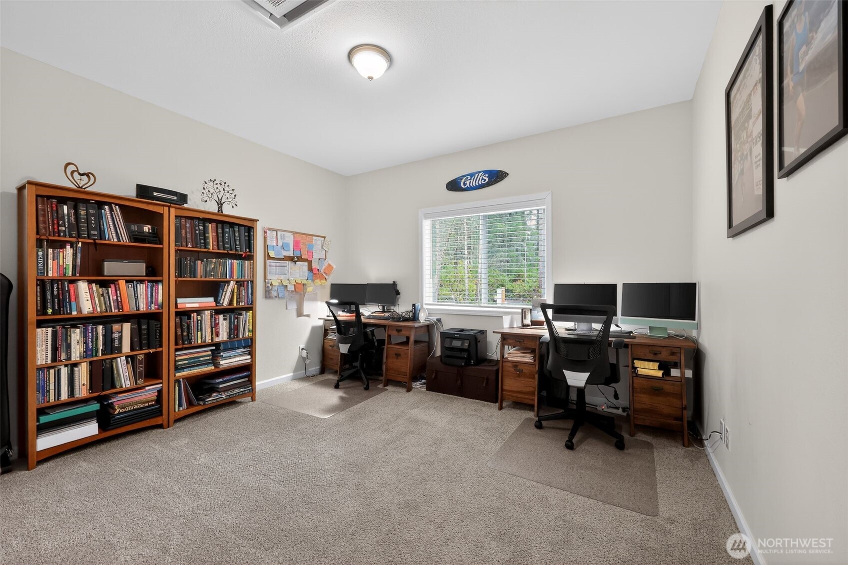 148 East Fox Run Lane Grapeview, WA 98546 - Photo 25 of 32 a view of a workspace with bookshelf and a window