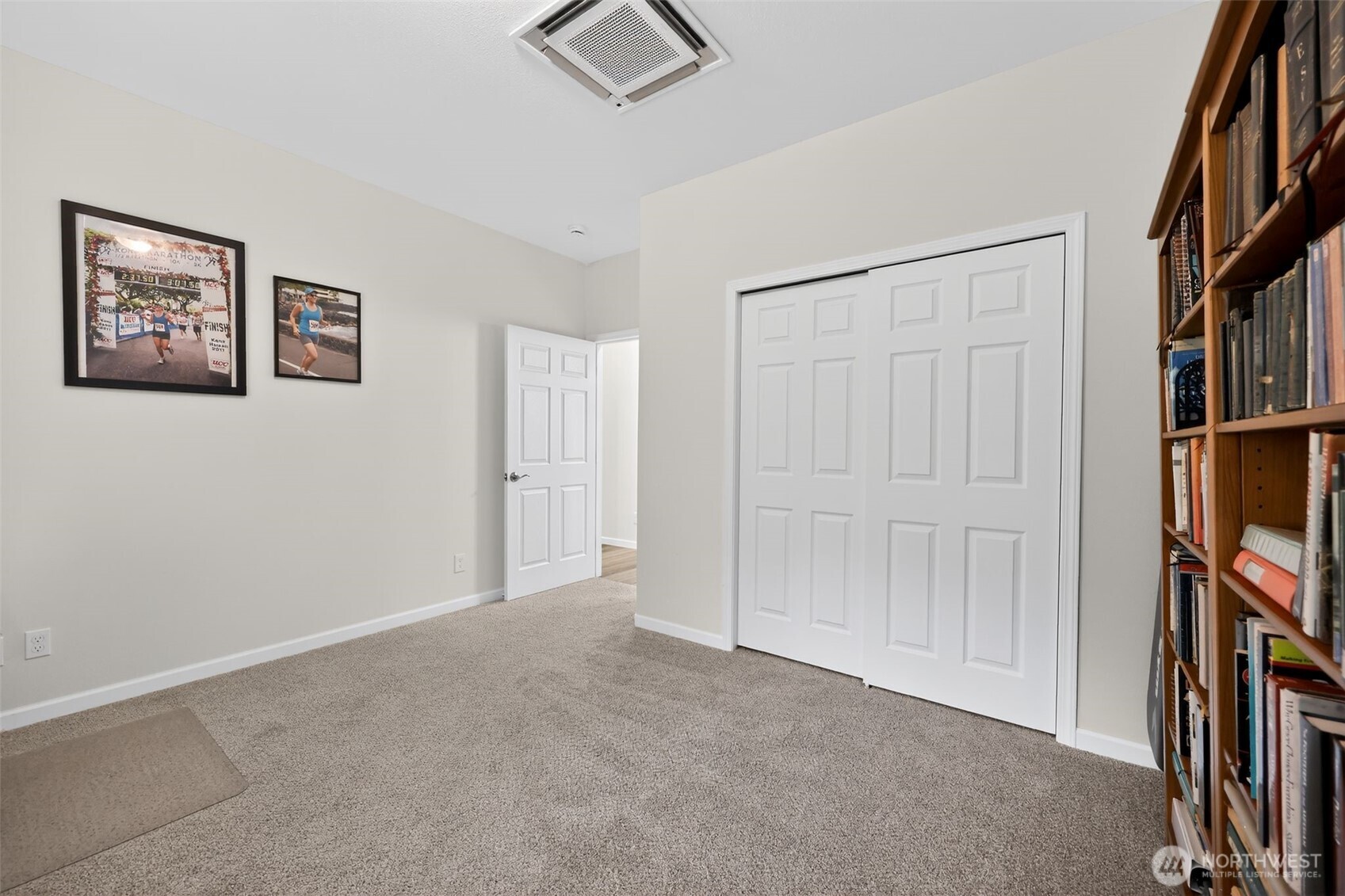 148 East Fox Run Lane Grapeview, WA 98546 - Photo 26 of 32 an empty room with bookshelf