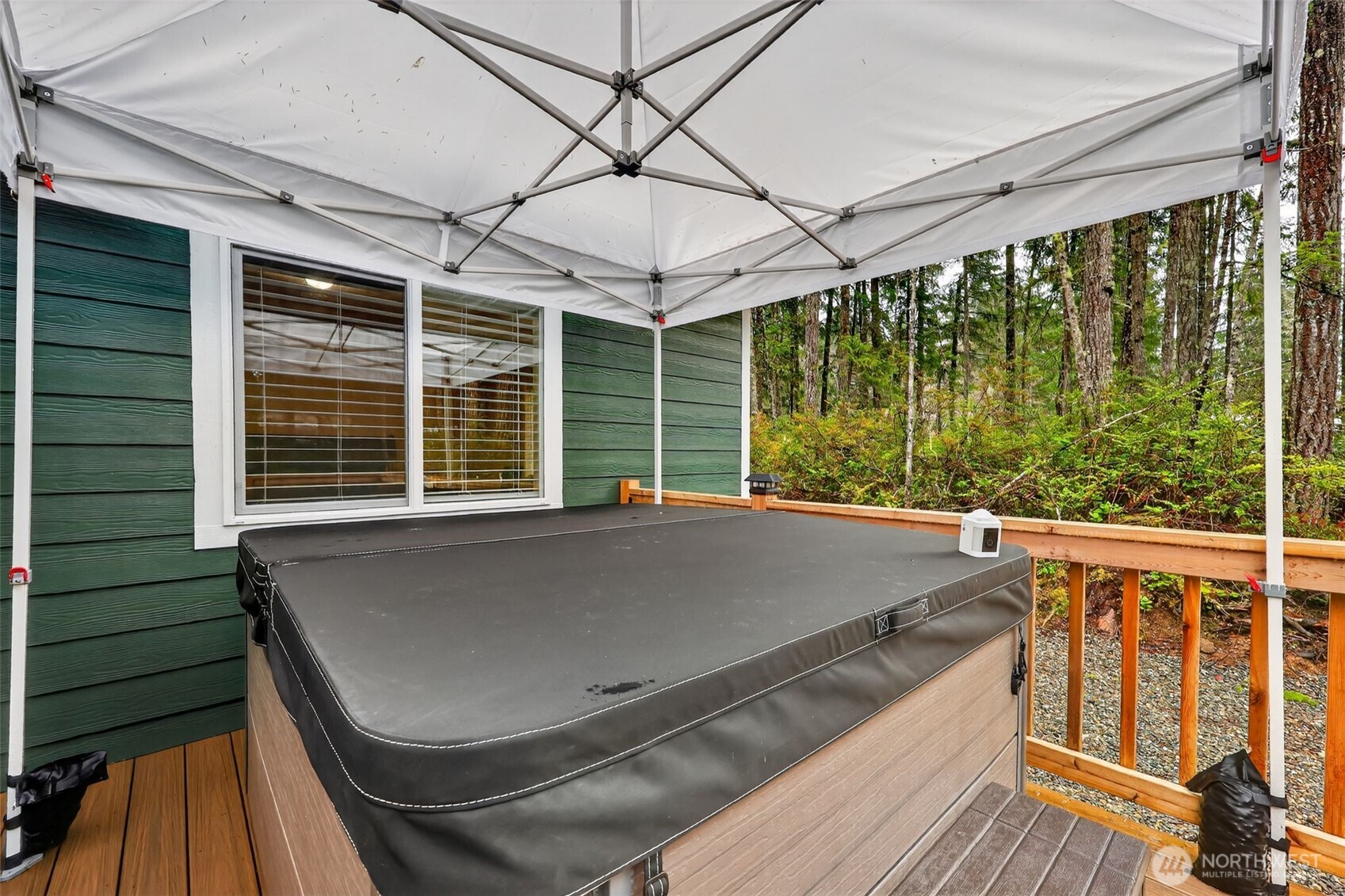 148 East Fox Run Lane Grapeview, WA 98546 - Photo 27 of 32 a view of balcony with couch and wooden floor