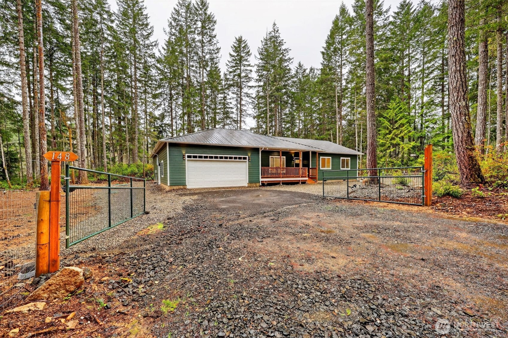 148 East Fox Run Lane Grapeview, WA 98546 - Photo 31 of 32 a front view of a house with a yard