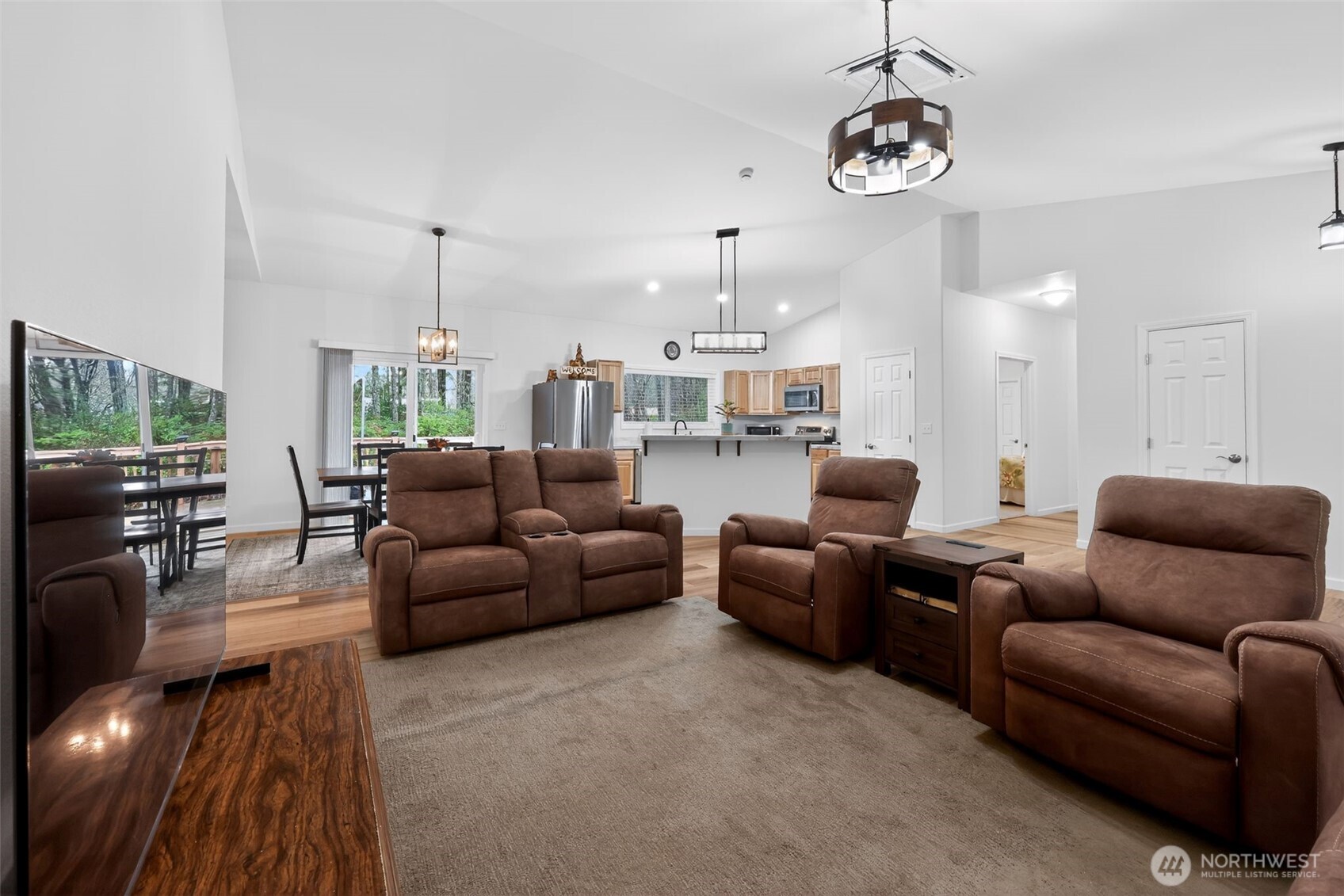148 East Fox Run Lane Grapeview, WA 98546 - Photo 5 of 32 a living room with furniture kitchen view and a chandelier