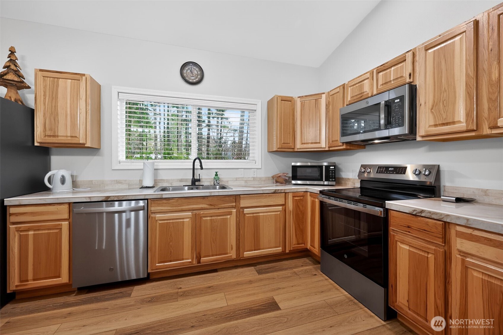 148 East Fox Run Lane Grapeview, WA 98546 - Photo 9 of 32 a kitchen with stainless steel appliances granite countertop a sink and stove top oven