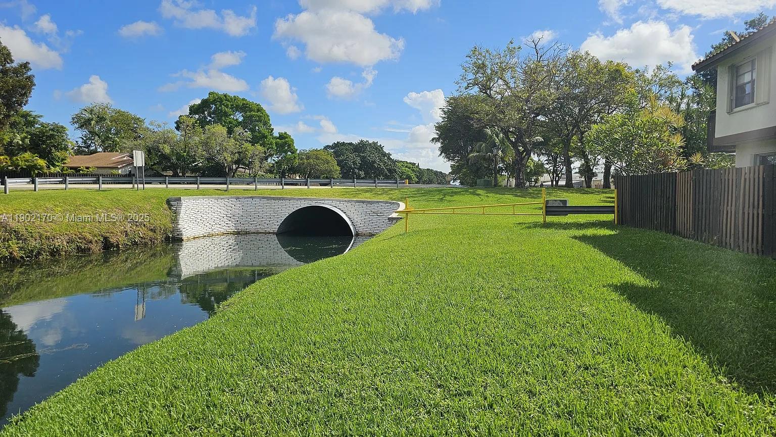 13235 Southwest 110th Terrace, Unit 183 Miami, FL 33186 - Photo 13 of 14 a view of a golf course with a lake