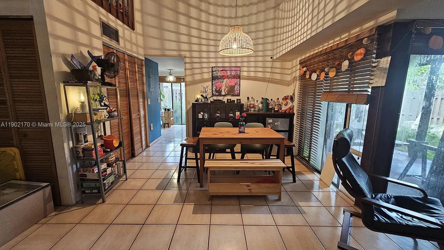 13235 Southwest 110th Terrace, Unit 183 Miami, FL 33186 - Photo 2 of 14 a outdoor space with lots of furniture and a fireplace