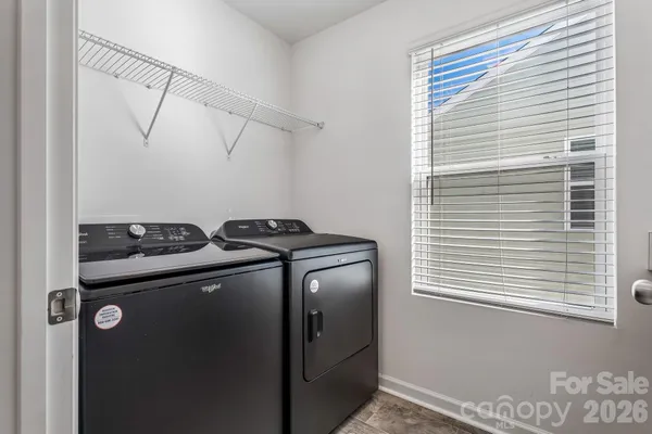 a view of storage and utility room with washer and dryer