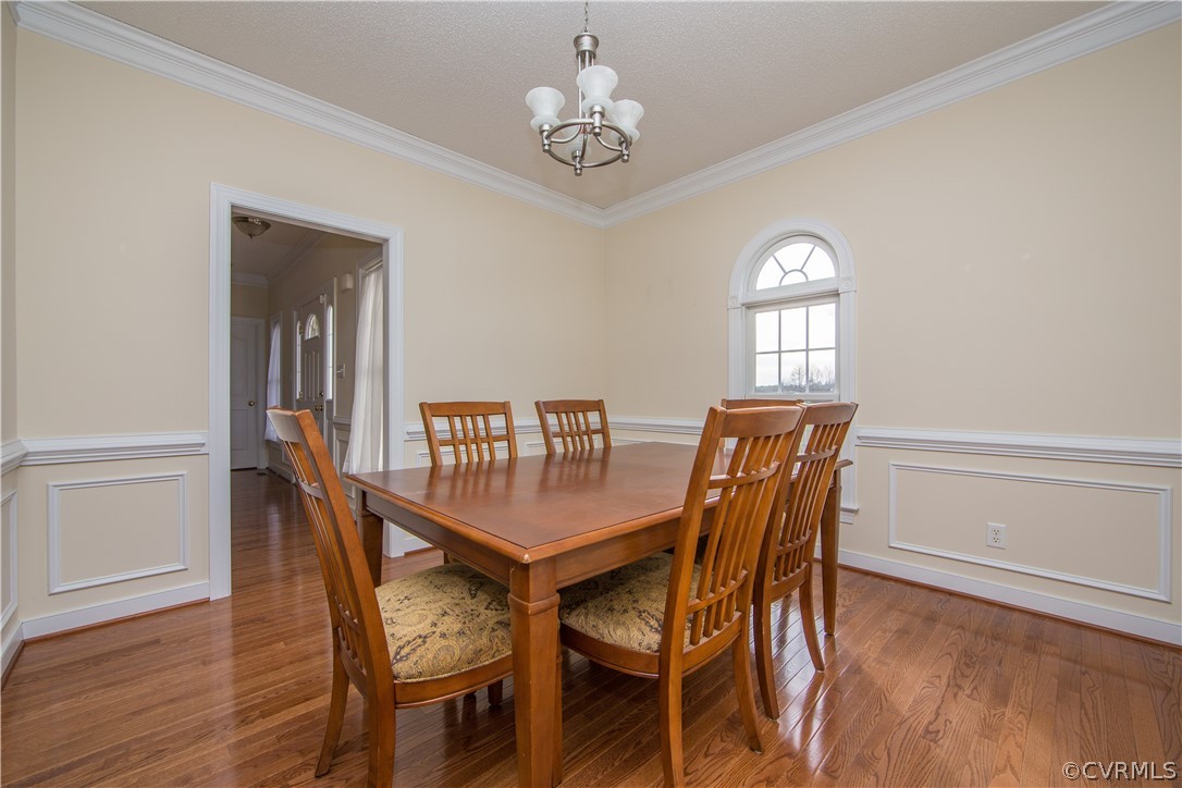 16840 Loving Union Road Disputanta, VA 23842 - Photo 11 of 35 a view of a dining room with furniture window and wooden floor