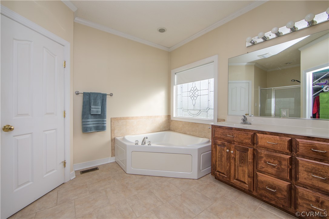 16840 Loving Union Road Disputanta, VA 23842 - Photo 14 of 35 a spacious bathroom with a tub sink and mirror
