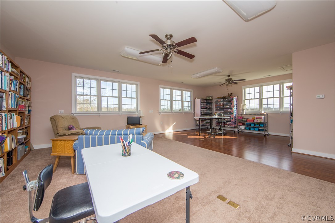 16840 Loving Union Road Disputanta, VA 23842 - Photo 26 of 35 a living room with furniture a flat screen tv and a book shelf