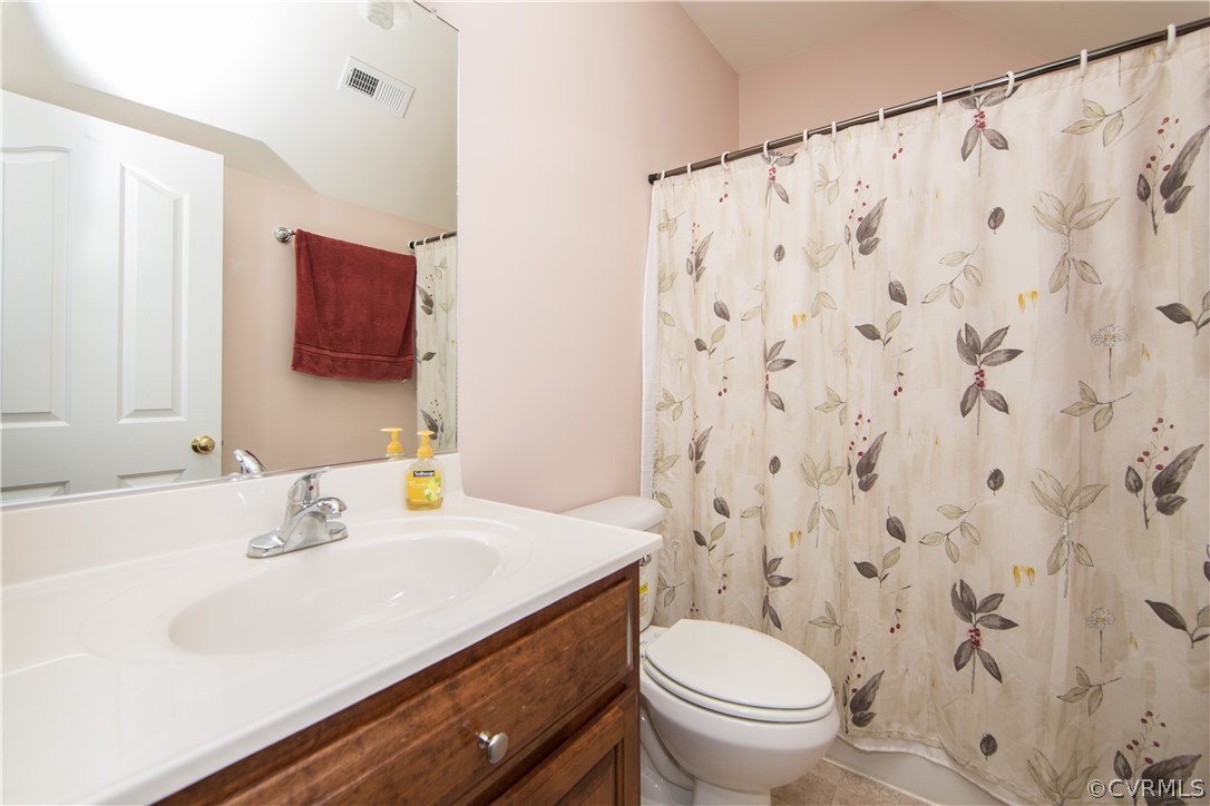 16840 Loving Union Road Disputanta, VA 23842 - Photo 27 of 35 a bathroom with a sink toilet and a mirror