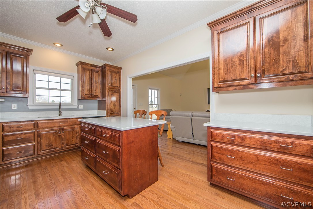 16840 Loving Union Road Disputanta, VA 23842 - Photo 8 of 35 a kitchen with stainless steel appliances granite countertop a sink a stove and a wooden floors