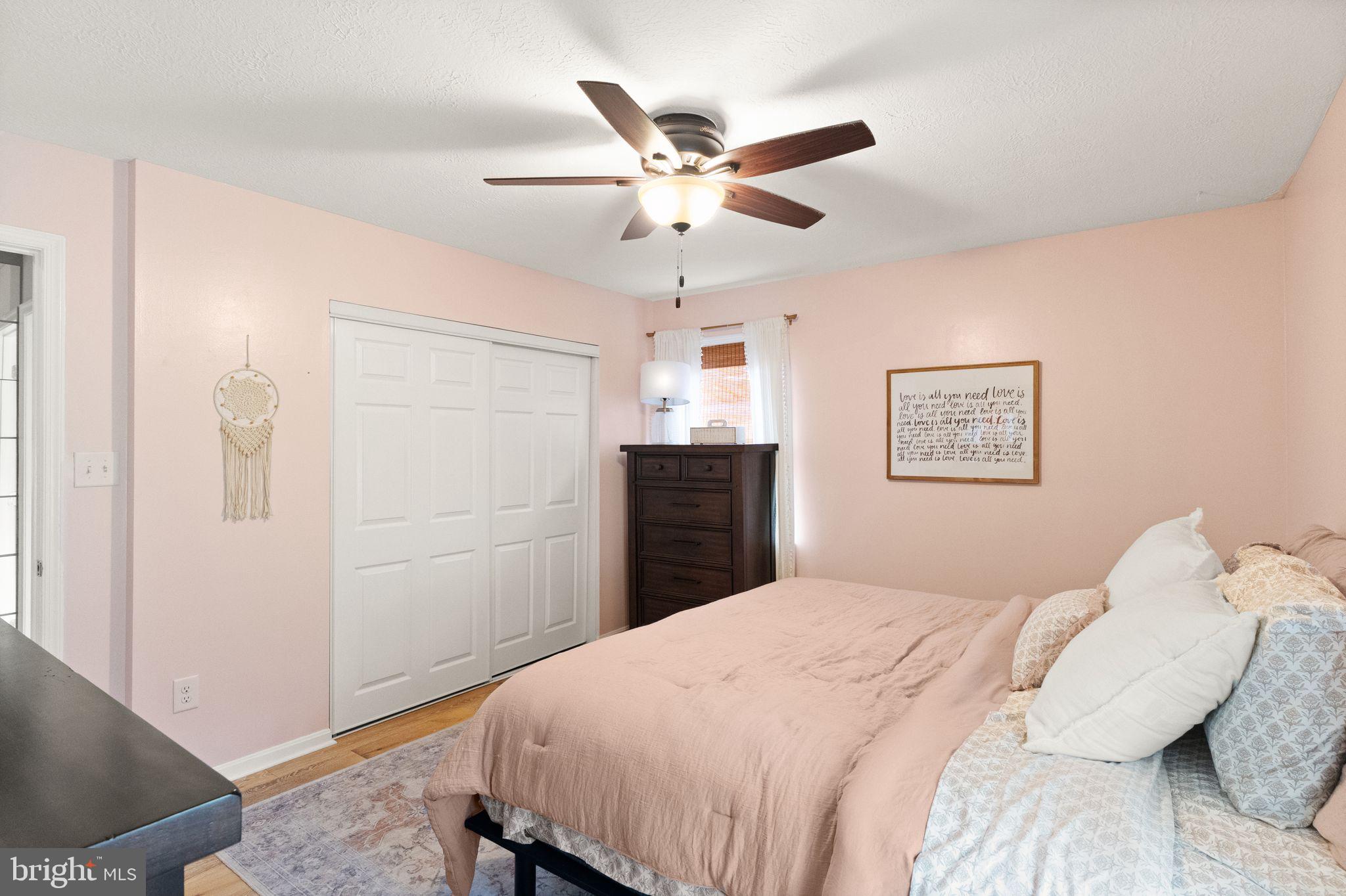 413 George Street Winchester, VA 22601 - Photo 20 of 54 a bedroom with a bed and a chandelier