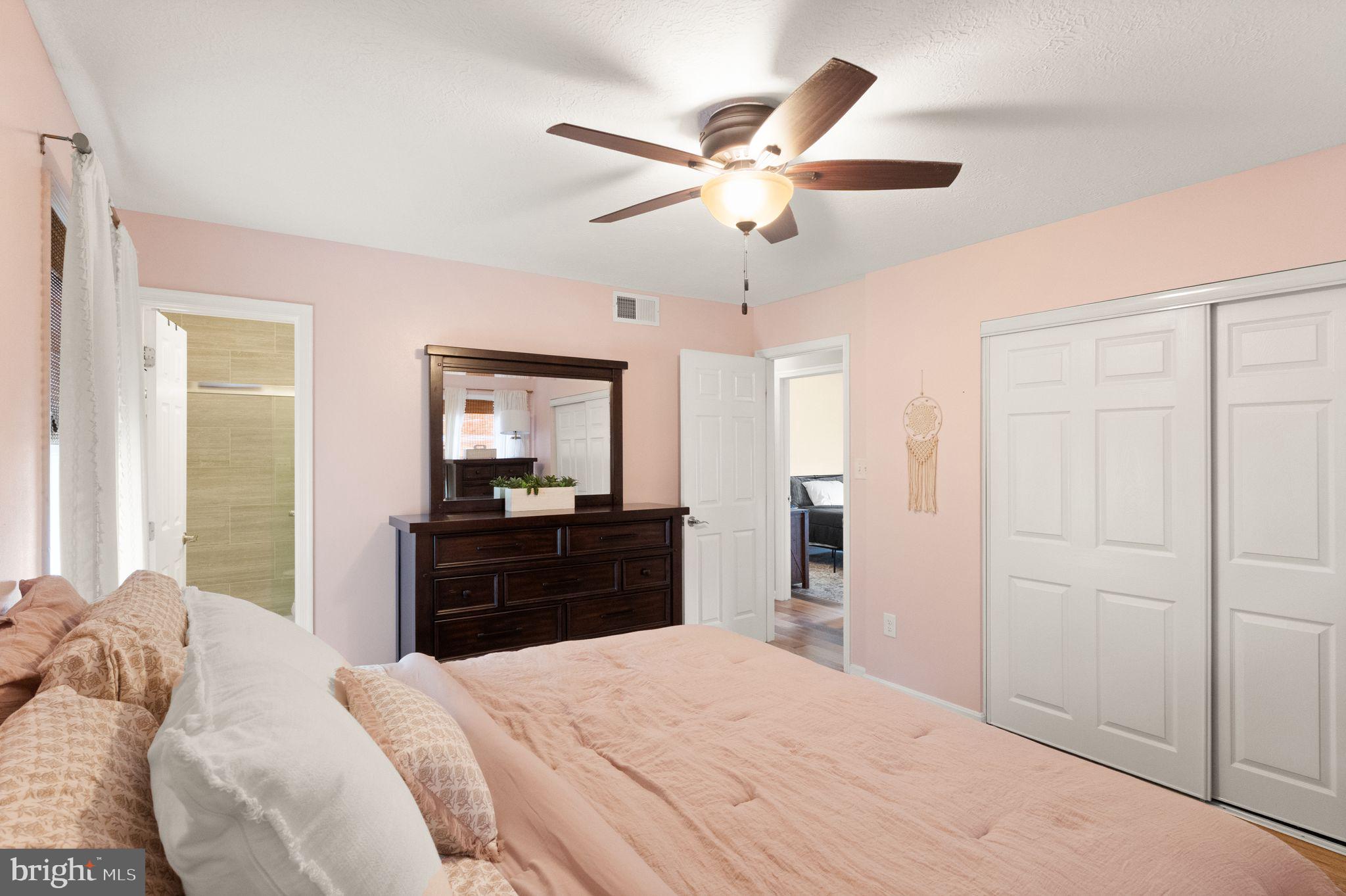 413 George Street Winchester, VA 22601 - Photo 21 of 54 a bedroom with a bed and a chandelier