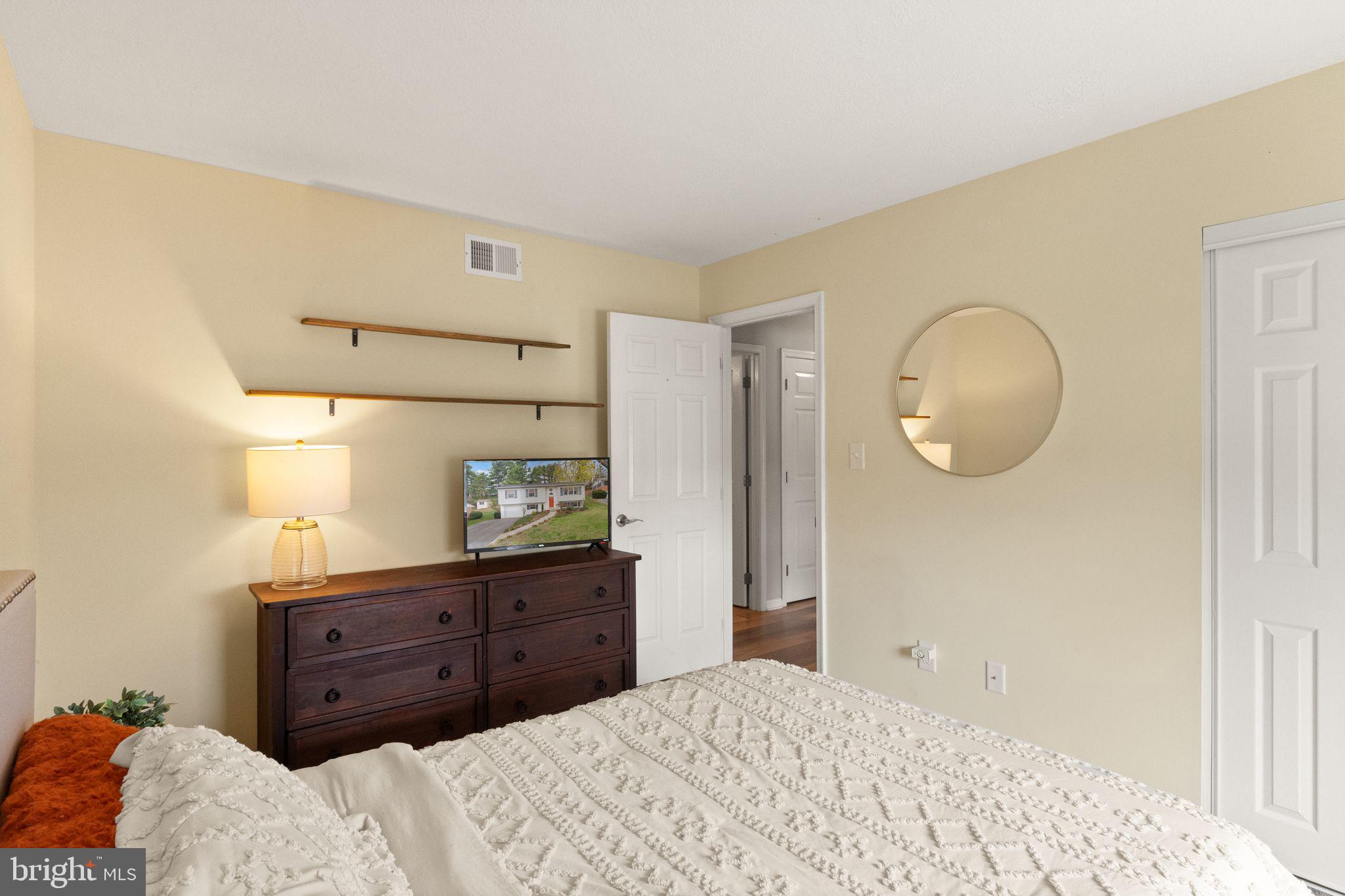 413 George Street Winchester, VA 22601 - Photo 25 of 54 a bedroom with a bed and a dresser