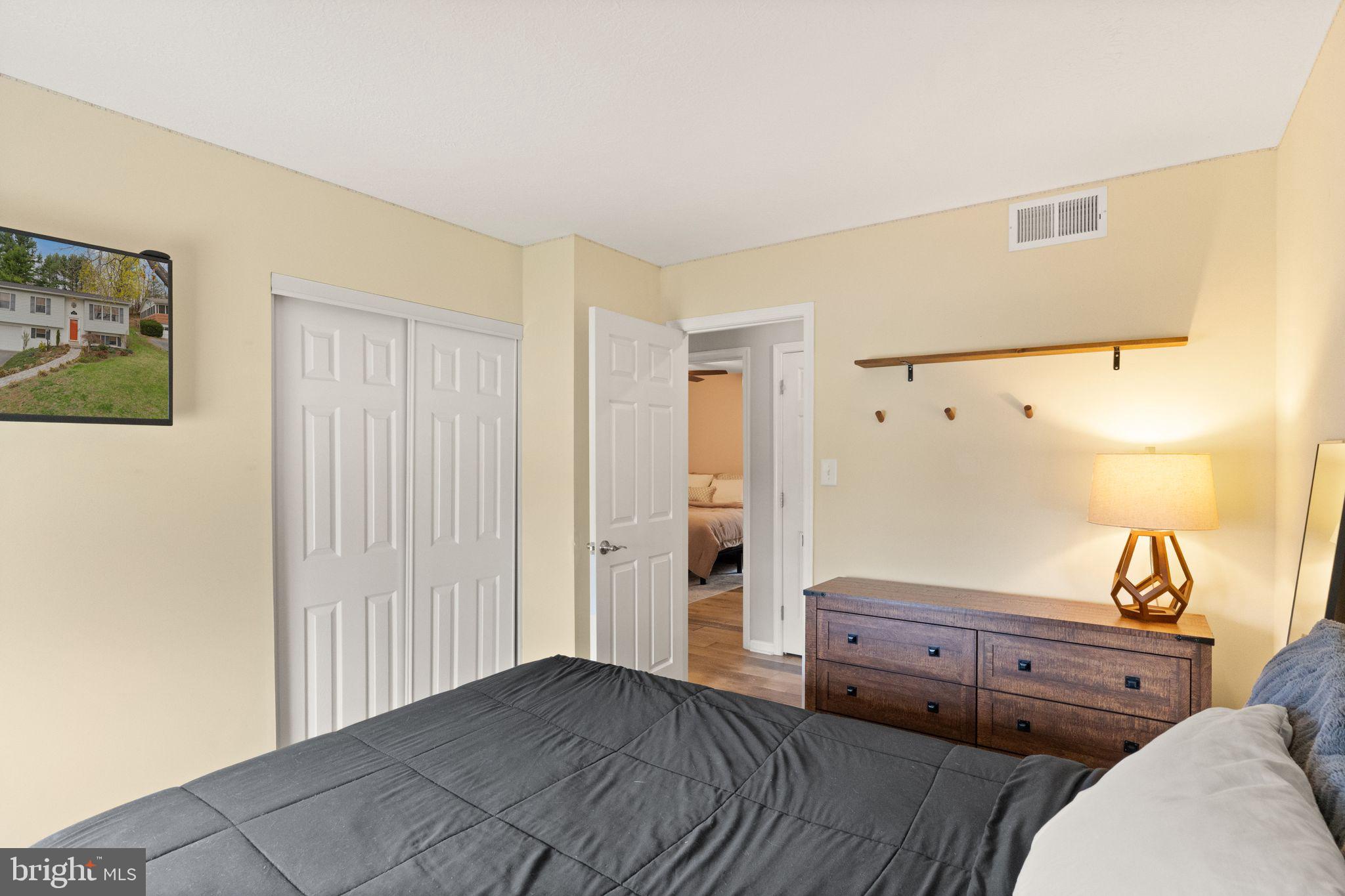 413 George Street Winchester, VA 22601 - Photo 27 of 54 a bedroom with a bed and cabinets