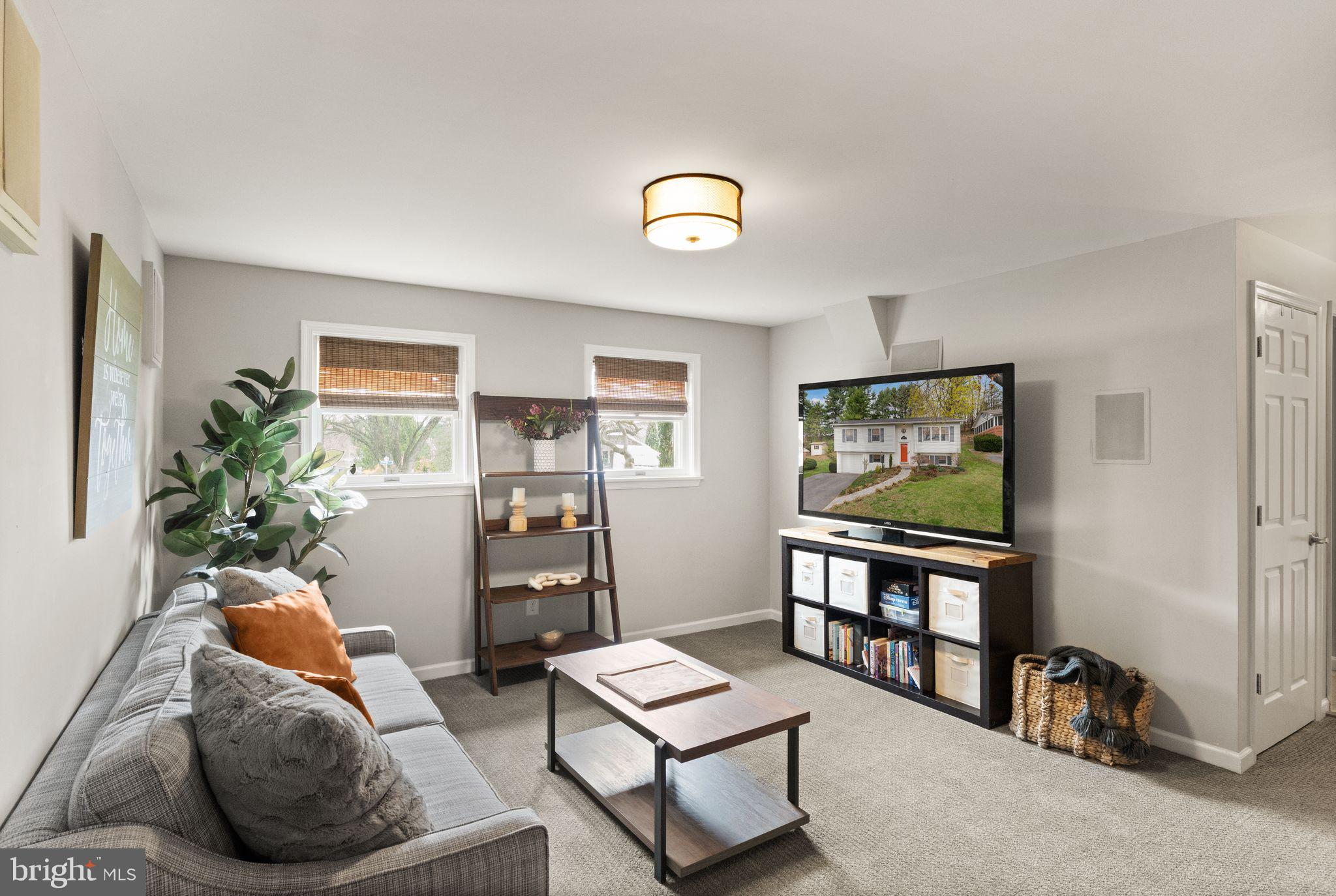 413 George Street Winchester, VA 22601 - Photo 33 of 54 a living room with furniture and a flat screen tv