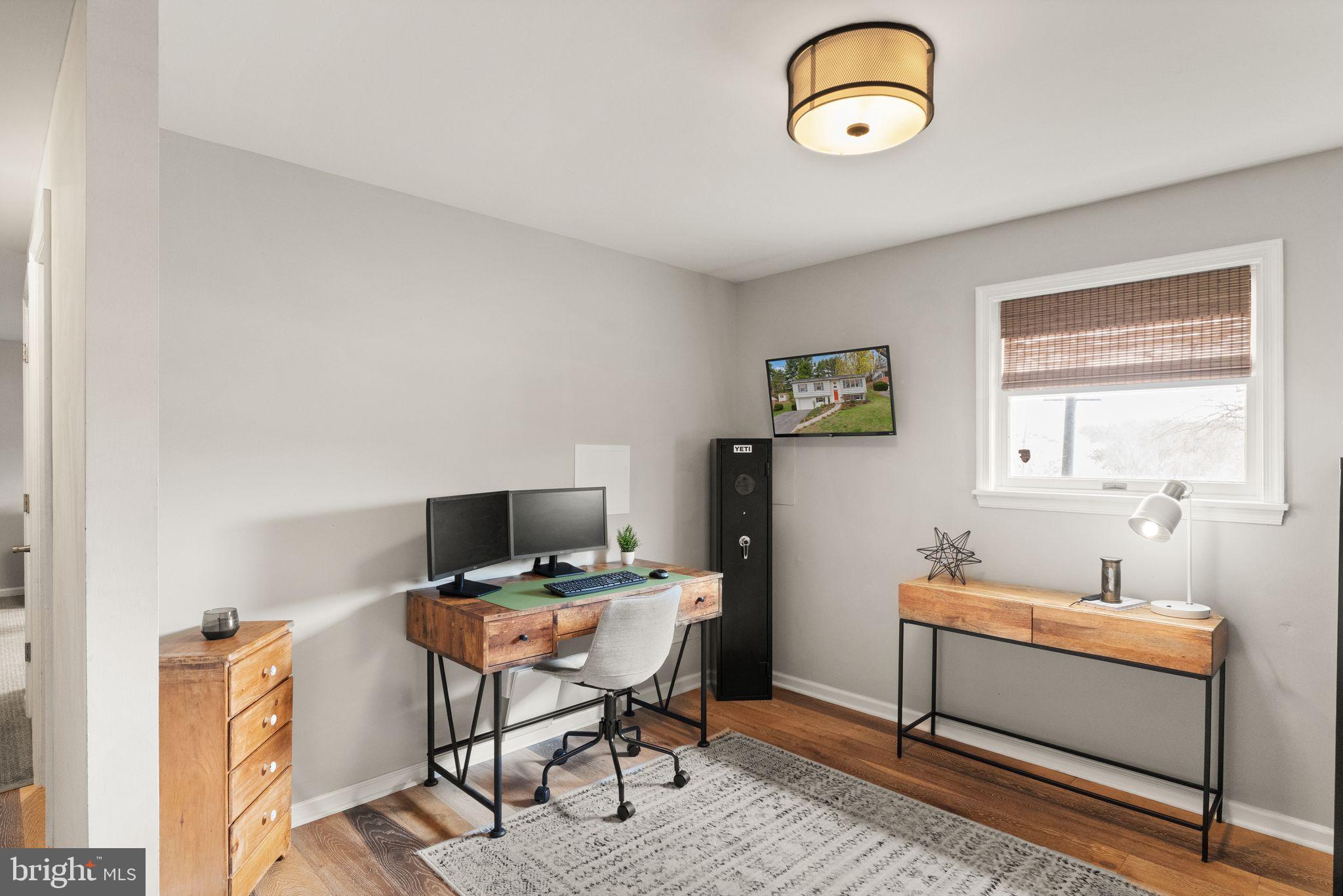 413 George Street Winchester, VA 22601 - Photo 38 of 54 a view of a workspace with furniture and a window