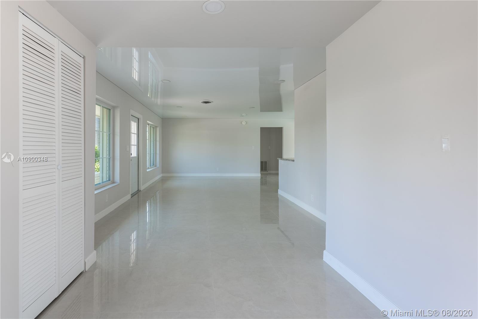 2630 Northeast 51st Court Lighthouse Point, FL 33064 - Photo 13 of 43 a view of empty room with wooden floor and fan