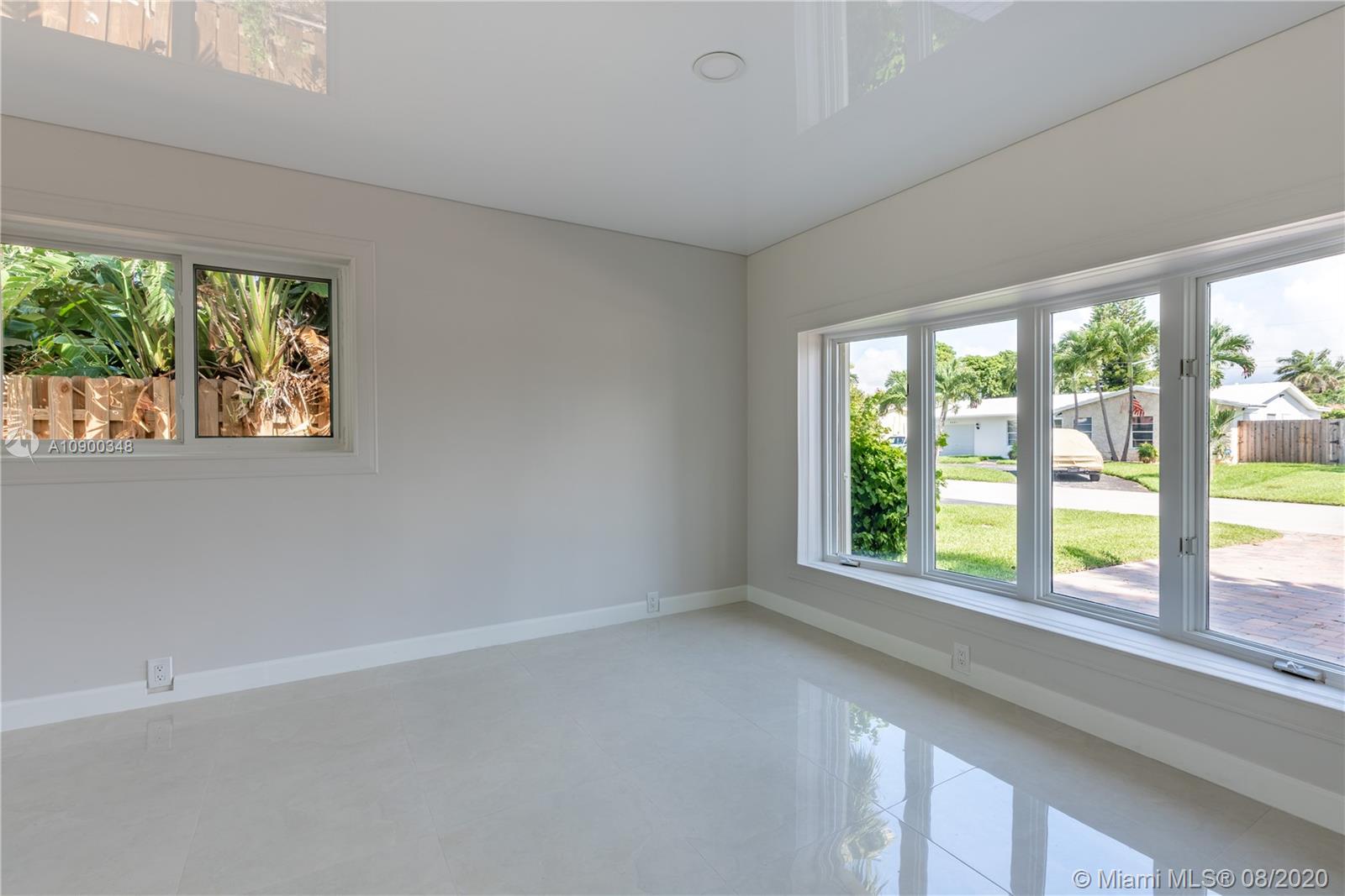 2630 Northeast 51st Court Lighthouse Point, FL 33064 - Photo 15 of 43 a view of an empty room with a window