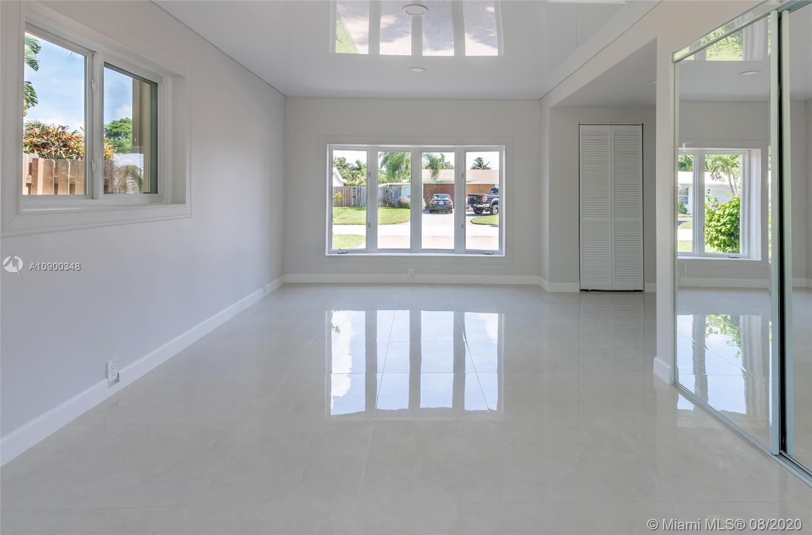 2630 Northeast 51st Court Lighthouse Point, FL 33064 - Photo 16 of 43 a view of an empty room with a window