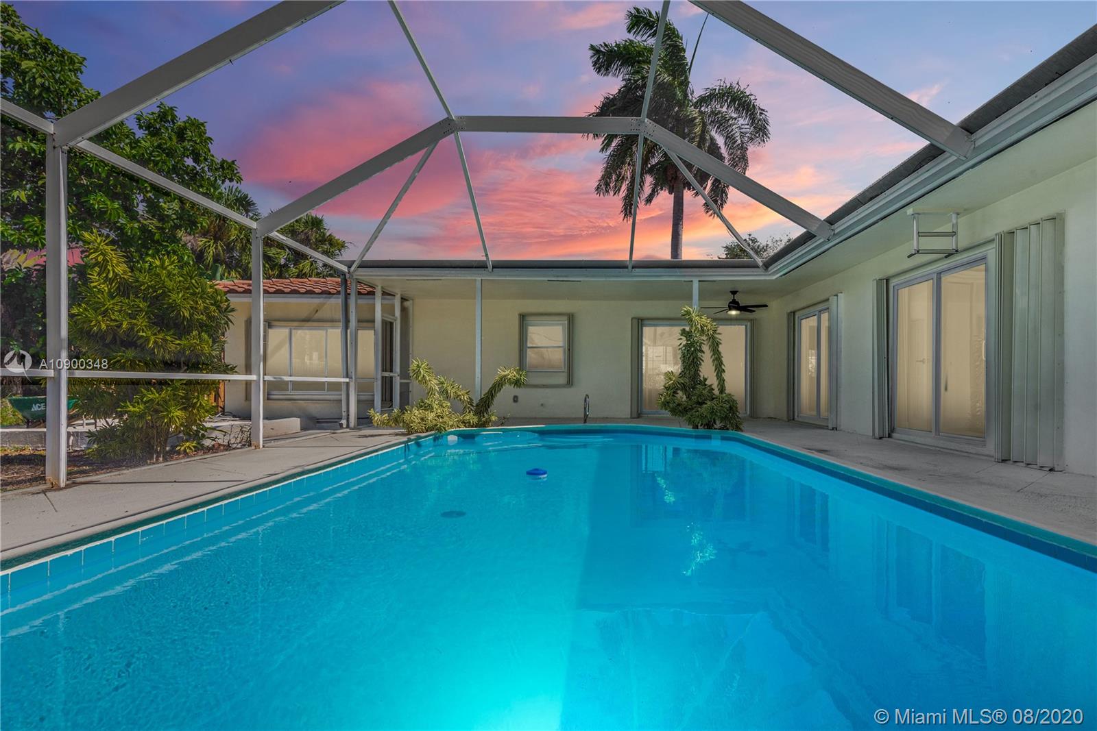 2630 Northeast 51st Court Lighthouse Point, FL 33064 - Photo 2 of 43 a view of backyard with green space