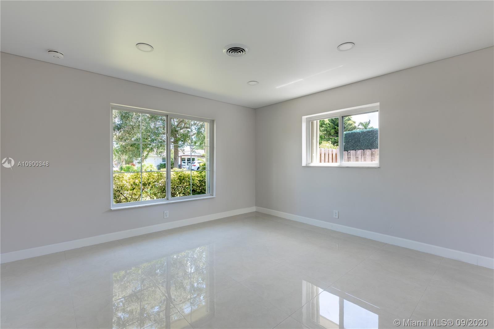 2630 Northeast 51st Court Lighthouse Point, FL 33064 - Photo 23 of 43 a view of an empty room with windows