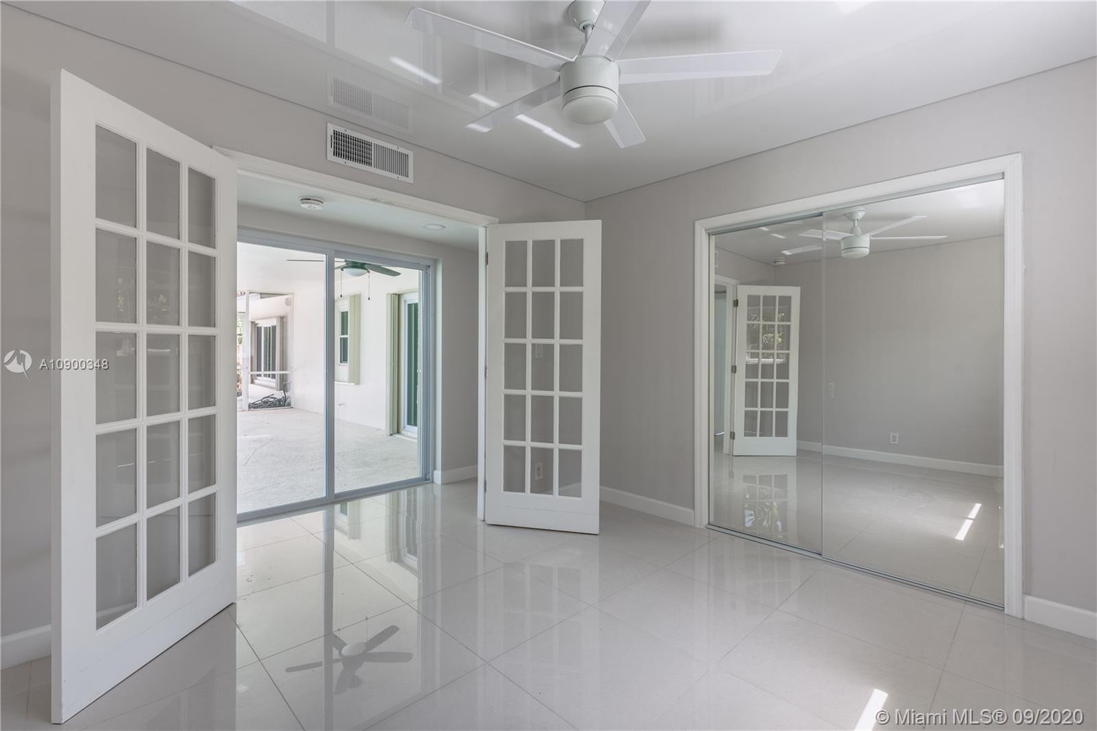 2630 Northeast 51st Court Lighthouse Point, FL 33064 - Photo 26 of 43 an empty room with windows