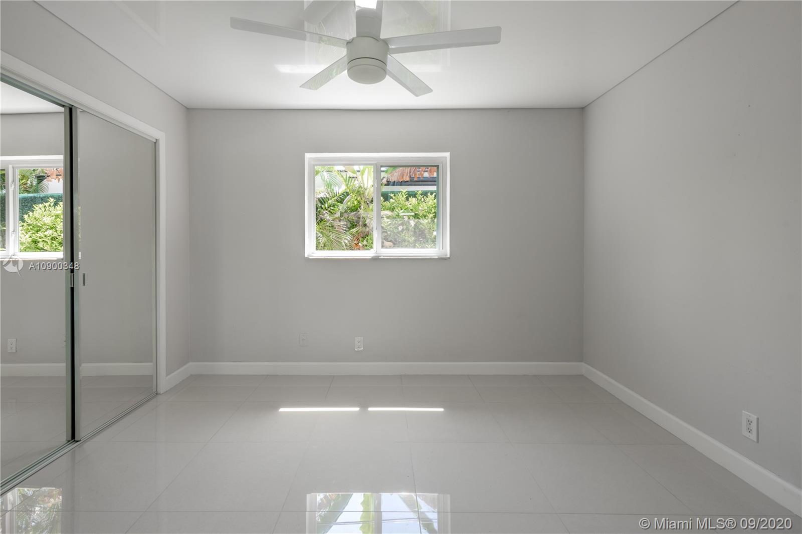 2630 Northeast 51st Court Lighthouse Point, FL 33064 - Photo 27 of 43 an empty room with a window