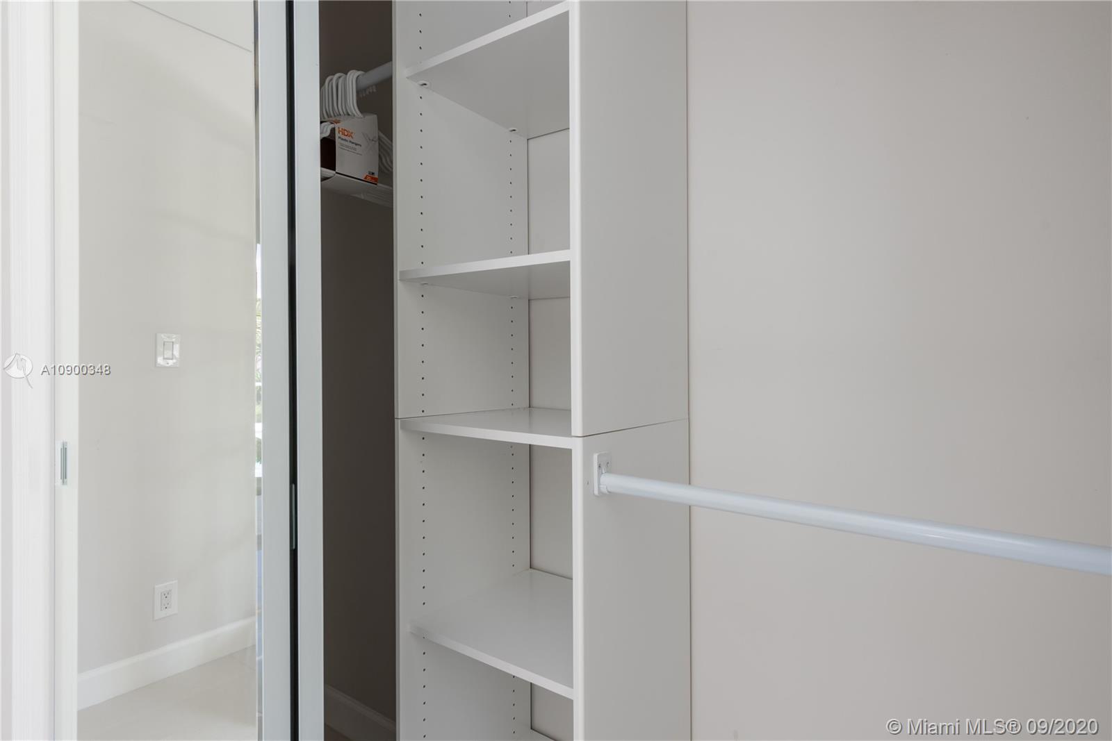 2630 Northeast 51st Court Lighthouse Point, FL 33064 - Photo 28 of 43 a view of walk in closet with empty racks