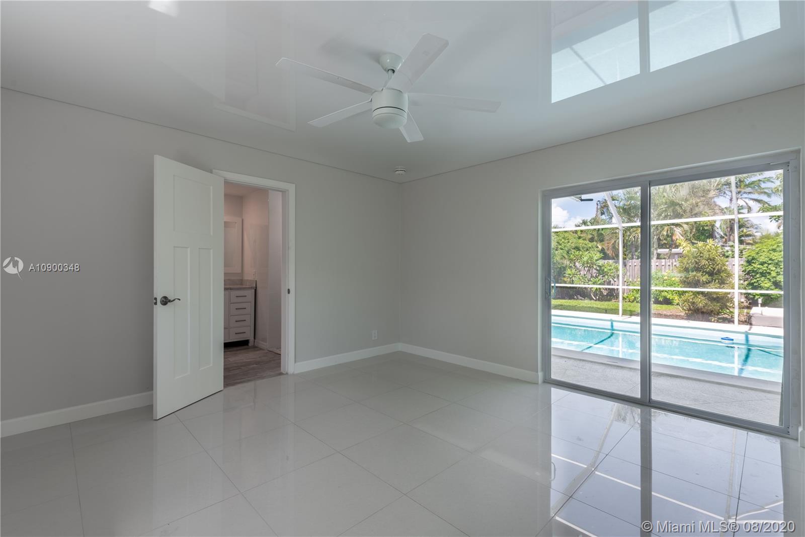 2630 Northeast 51st Court Lighthouse Point, FL 33064 - Photo 29 of 43 a view of an empty room with a window