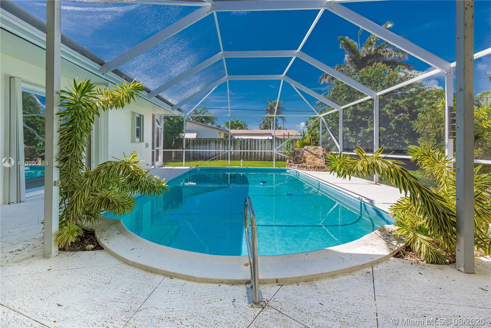 2630 Northeast 51st Court Lighthouse Point, FL 33064 - Photo 35 of 43 a view of a backyard with garden and patio