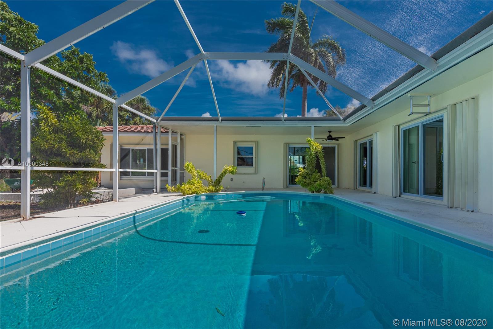 2630 Northeast 51st Court Lighthouse Point, FL 33064 - Photo 36 of 43 a view of a house with a backyard
