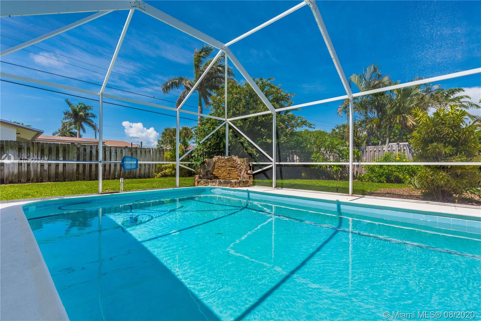 2630 Northeast 51st Court Lighthouse Point, FL 33064 - Photo 37 of 43 a view of a backyard with swimming pool
