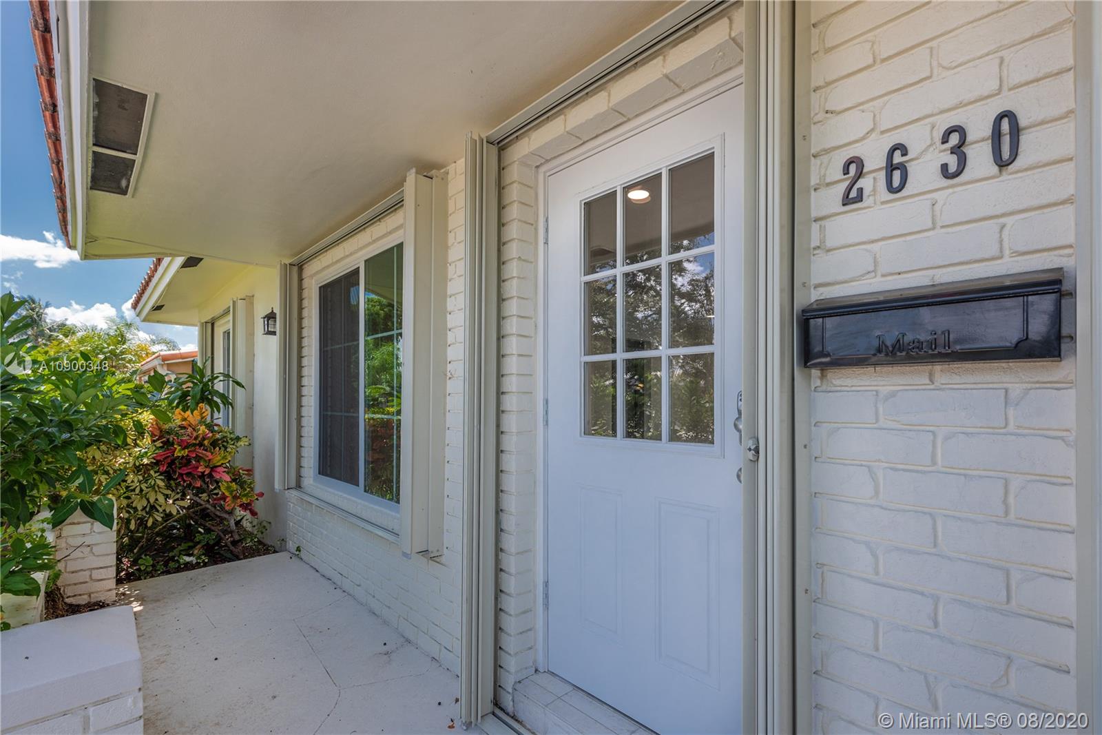 2630 Northeast 51st Court Lighthouse Point, FL 33064 - Photo 7 of 43 a view of entrance front of house