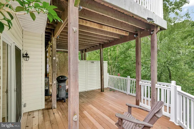 a view of a chair and table in the balcony