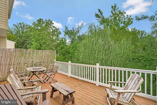 a view of a chair and table on the deck