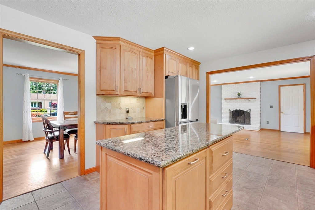 5 Evergreen Circle Wilbraham, MA 01095 - Photo 12 of 39 a kitchen with granite countertop a stove and white cabinets