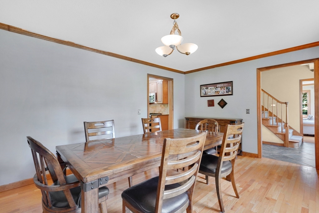 5 Evergreen Circle Wilbraham, MA 01095 - Photo 14 of 39 a view of a dining room with furniture and wooden floor