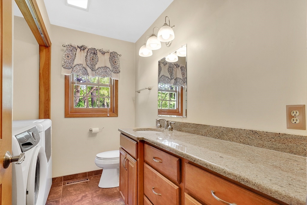 5 Evergreen Circle Wilbraham, MA 01095 - Photo 15 of 39 a bathroom with a granite countertop sink a large mirror and a toilet