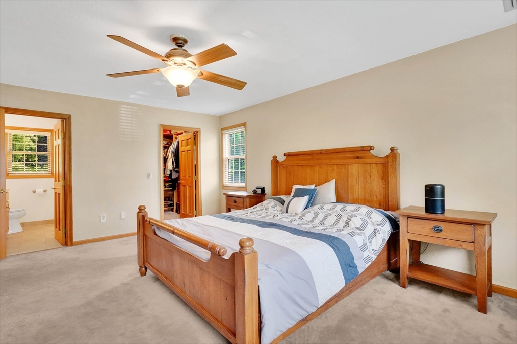 5 Evergreen Circle Wilbraham, MA 01095 - Photo 19 of 39 a bed room with a bed and a chandelier