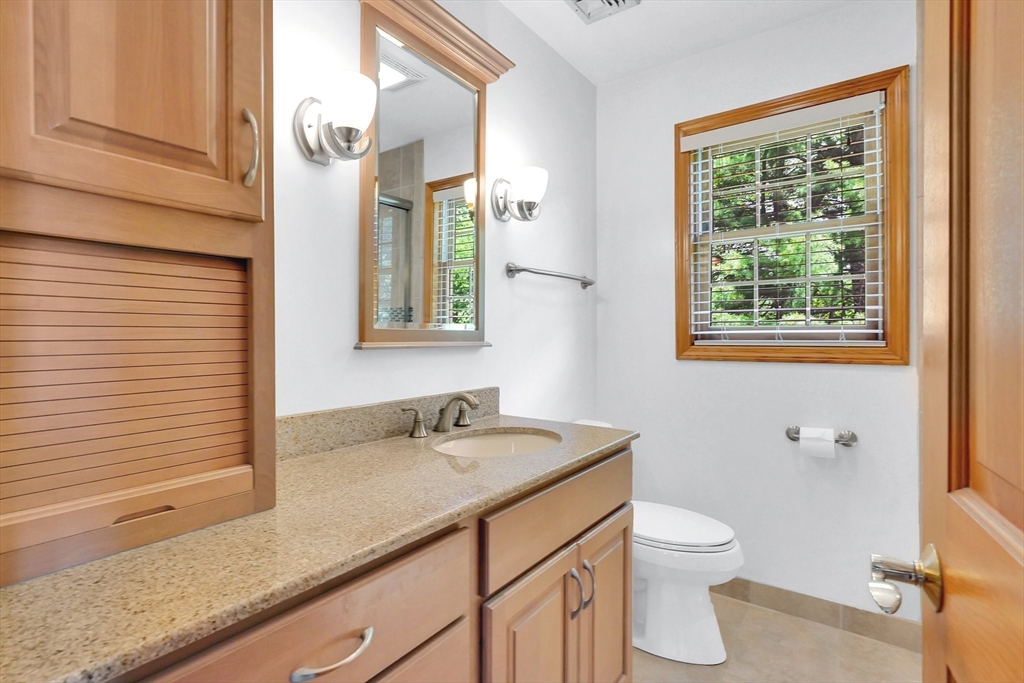 5 Evergreen Circle Wilbraham, MA 01095 - Photo 21 of 39 a bathroom with a granite countertop sink toilet and shower