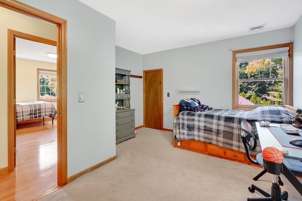 5 Evergreen Circle Wilbraham, MA 01095 - Photo 27 of 39 a view of a bedroom with gym equipment
