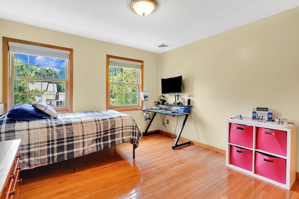 5 Evergreen Circle Wilbraham, MA 01095 - Photo 28 of 39 a bedroom with a bed and a flat screen tv