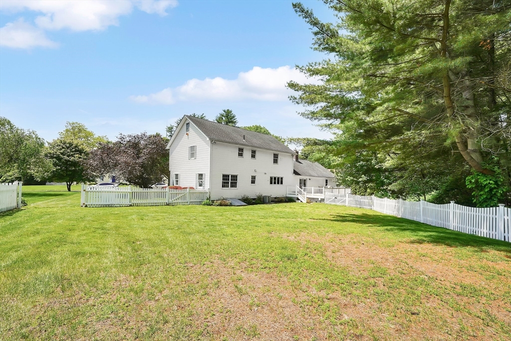 5 Evergreen Circle Wilbraham, MA 01095 - Photo 3 of 39 a view of a house with a yard and a garage