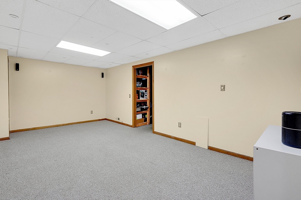 5 Evergreen Circle Wilbraham, MA 01095 - Photo 31 of 39 an empty room with a empty space and a flat screen tv