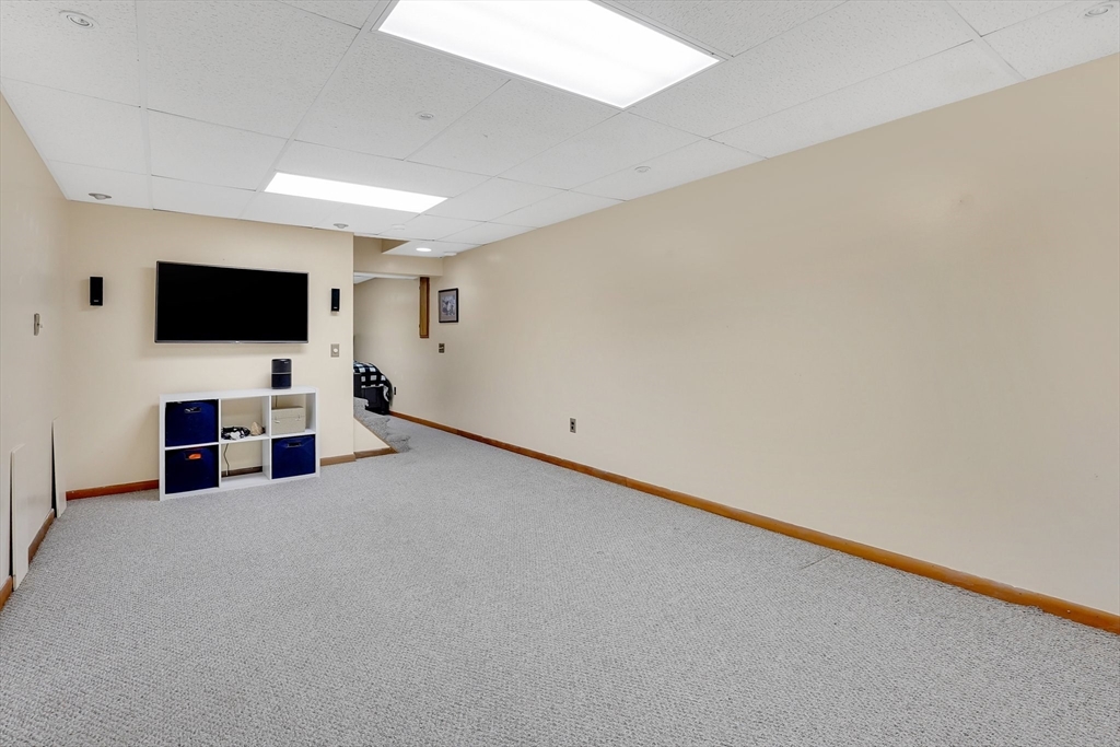 5 Evergreen Circle Wilbraham, MA 01095 - Photo 32 of 39 a view of a livingroom with entryway and flat screen tv